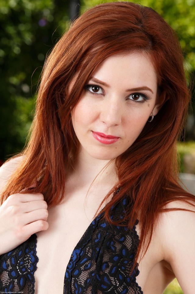Watch Ember Stone Take Off Her Lingerie In The Doorway!